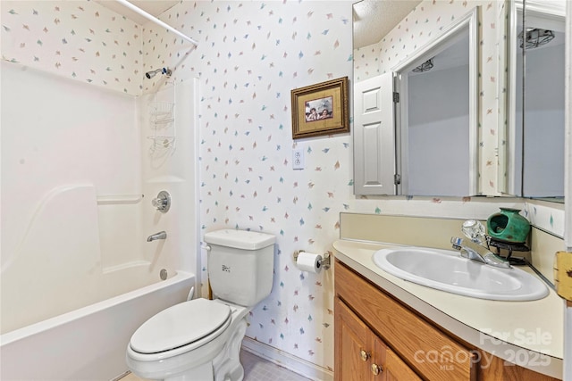 full bathroom with a textured ceiling, toilet, bathtub / shower combination, and vanity