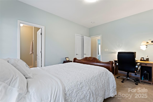 bedroom with carpet flooring and ensuite bath