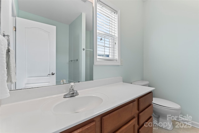 bathroom with tile patterned floors, toilet, and vanity