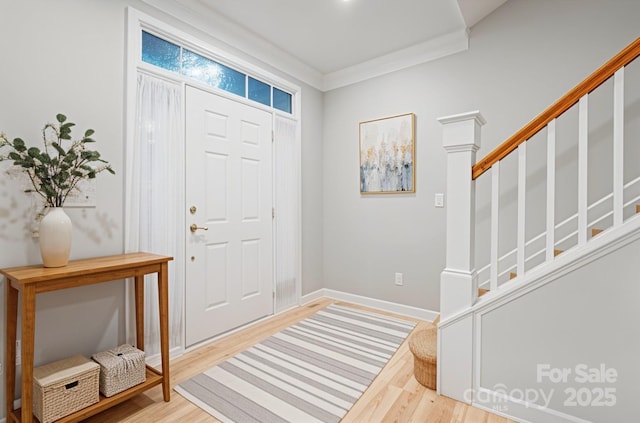entrance foyer with wood finished floors and baseboards