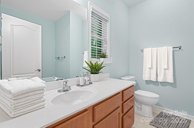 bathroom with toilet and vanity