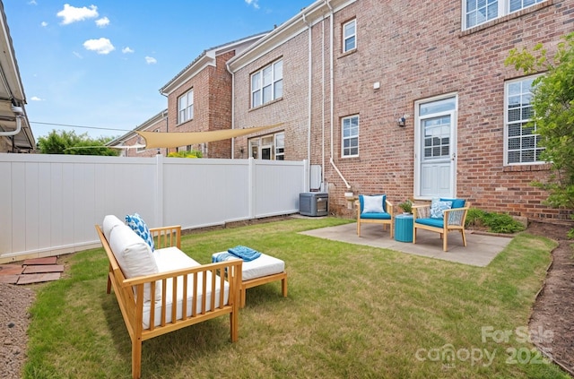 view of yard with a patio area, central air condition unit, and an outdoor living space