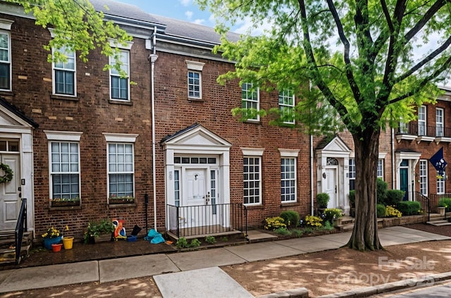 view of property featuring brick siding