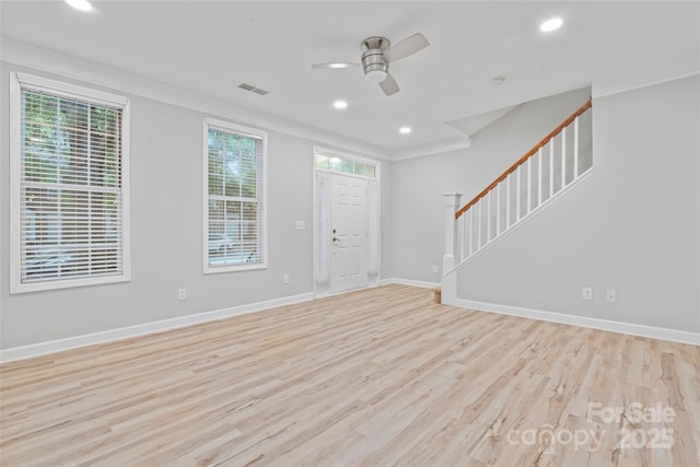 foyer featuring stairway, wood finished floors, ceiling fan, baseboards, and recessed lighting