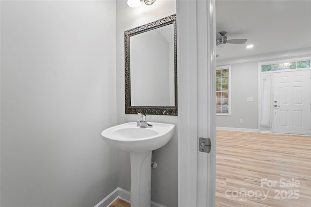bathroom featuring wood finished floors, baseboards, a ceiling fan, and recessed lighting