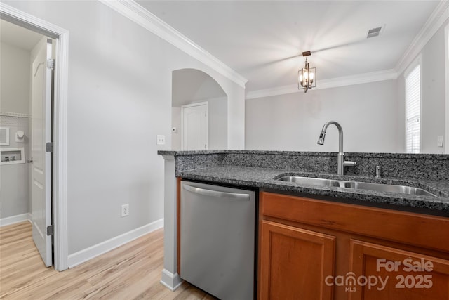 kitchen with stainless steel dishwasher, brown cabinetry, a sink, light wood-style flooring, and crown molding