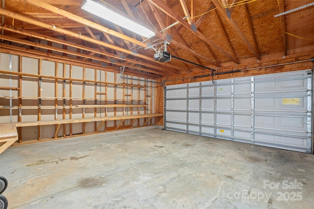 garage featuring a garage door opener