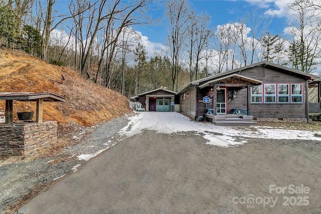 view of front of property with an outbuilding and a garage