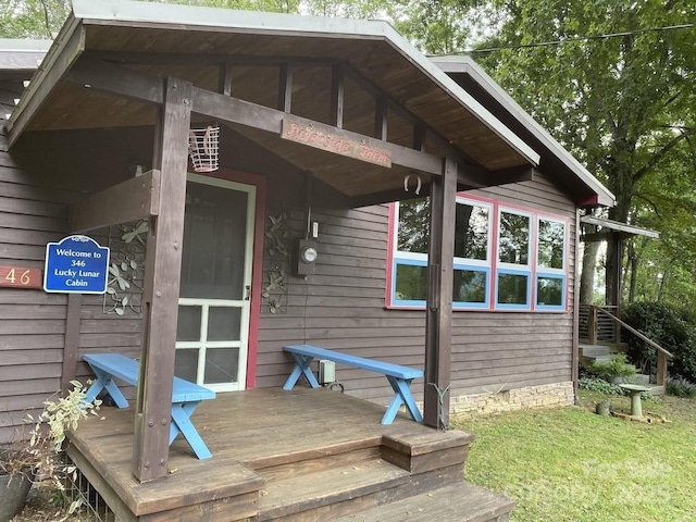 property entrance with a deck