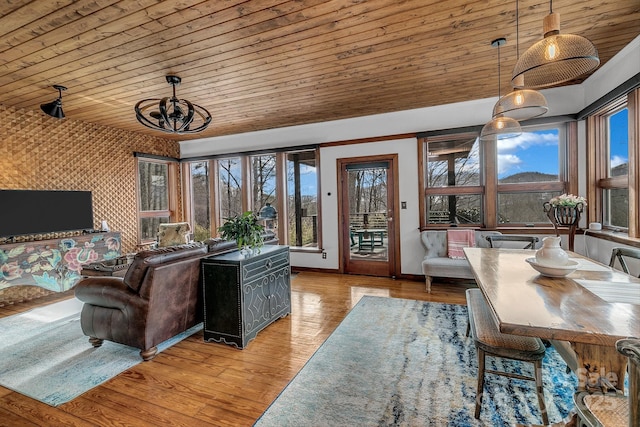 living room with wood ceiling and light hardwood / wood-style floors