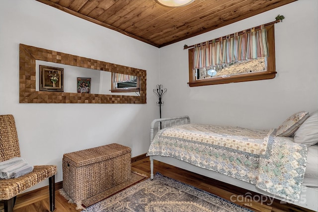 bedroom featuring crown molding, wood ceiling, and wood-type flooring