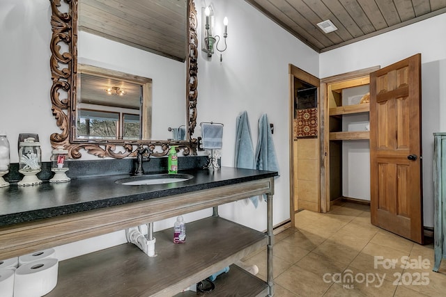 bathroom featuring wood ceiling, vanity, and tile patterned flooring