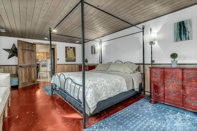 bedroom featuring wood ceiling and wood walls