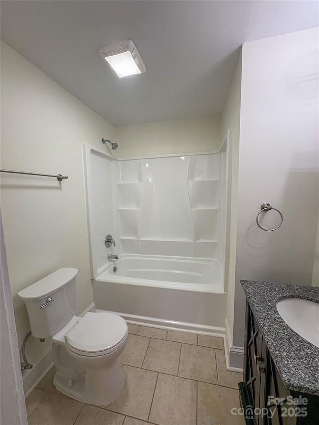 bathroom with  shower combination, vanity, toilet, and tile patterned floors