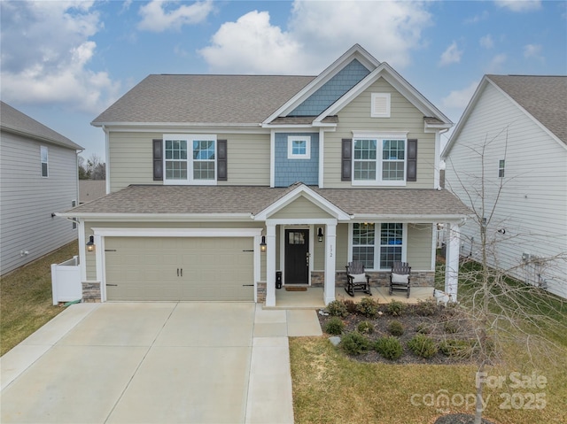 craftsman-style house with a garage and a porch