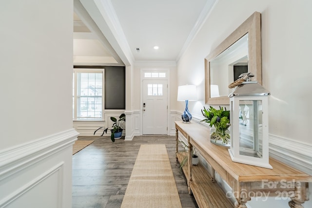 foyer featuring hardwood / wood-style floors and ornamental molding