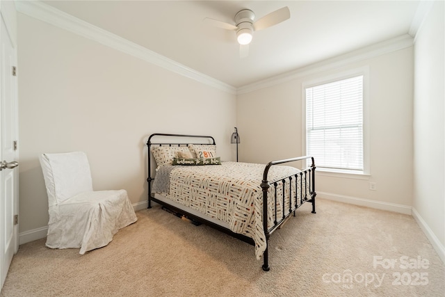 carpeted bedroom with ceiling fan and crown molding