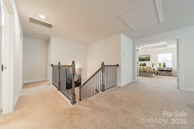 hallway with light carpet