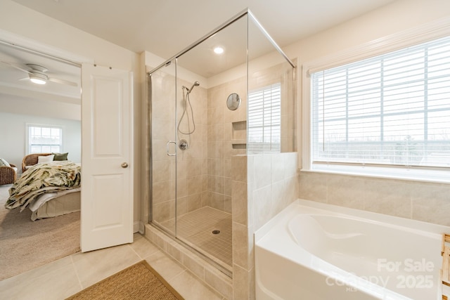 bathroom featuring tile patterned floors and independent shower and bath