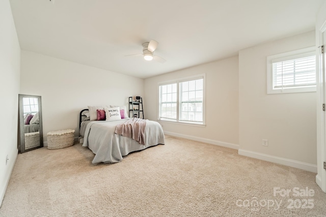 bedroom featuring ceiling fan and light colored carpet