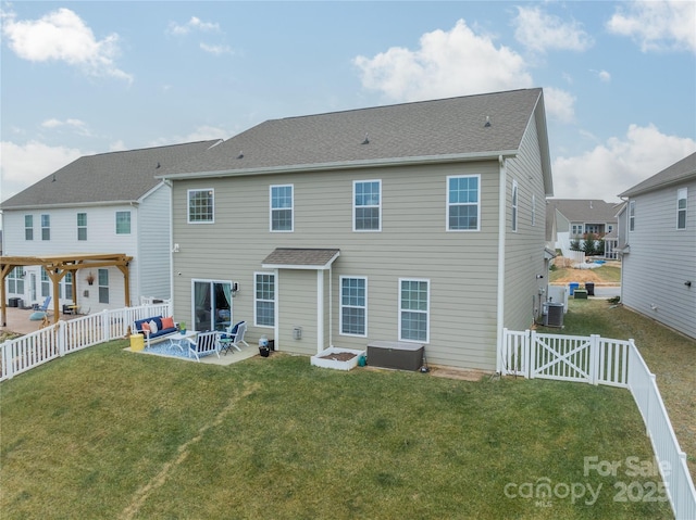 back of house featuring a patio area, a lawn, and central AC