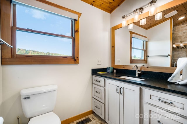 bathroom featuring wood ceiling, a healthy amount of sunlight, toilet, and vaulted ceiling