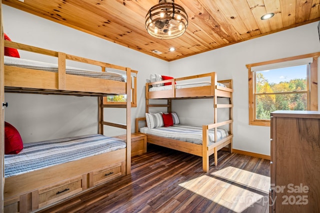 unfurnished bedroom featuring ornamental molding, dark wood-type flooring, and wood ceiling