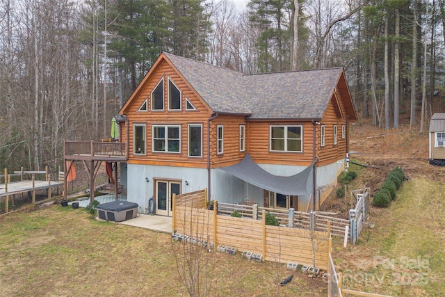 log home with a patio, a front lawn, and french doors