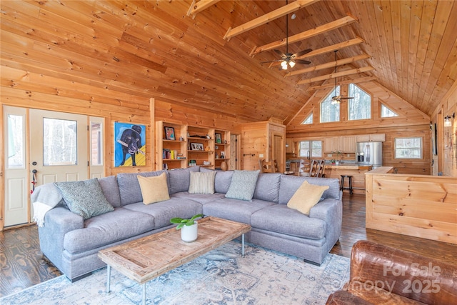 living room with high vaulted ceiling, wood walls, wood-type flooring, wooden ceiling, and beam ceiling