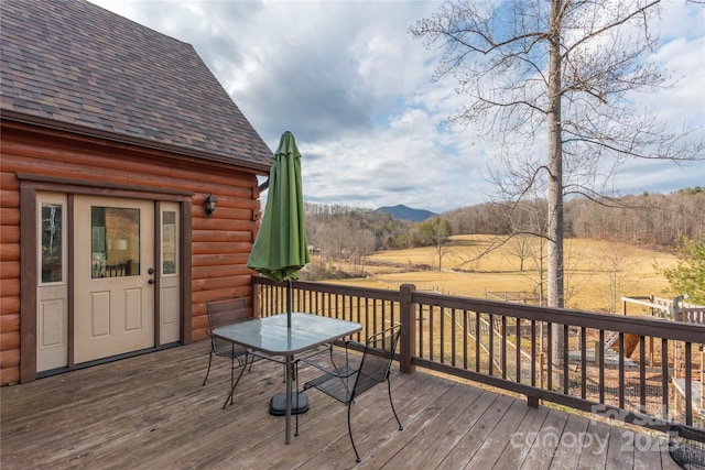 wooden terrace featuring a mountain view