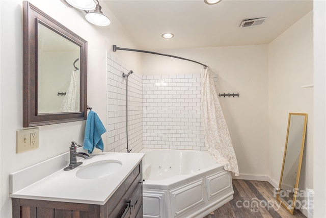 bathroom with vanity, hardwood / wood-style flooring, and shower / tub combo with curtain