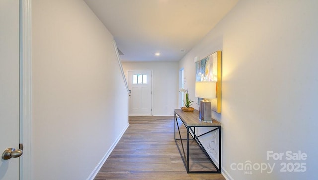 hallway with dark hardwood / wood-style flooring