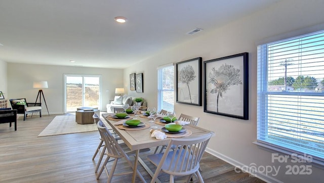 dining space featuring hardwood / wood-style flooring