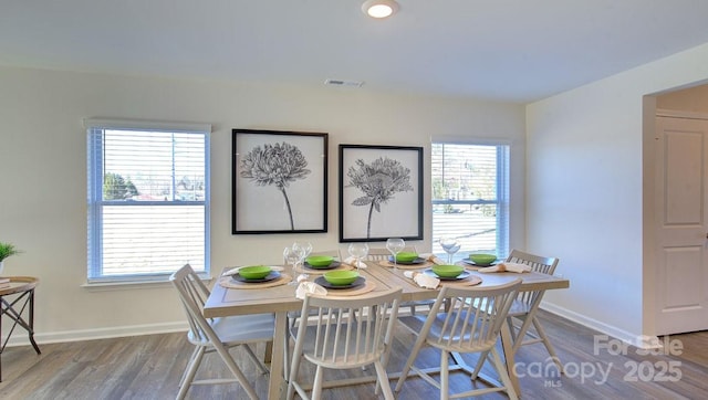 dining area with hardwood / wood-style floors