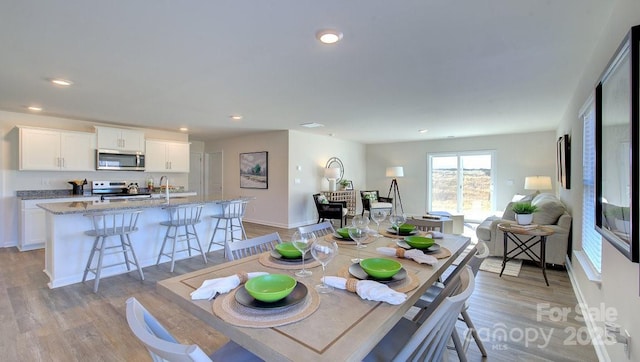 dining room featuring light hardwood / wood-style floors