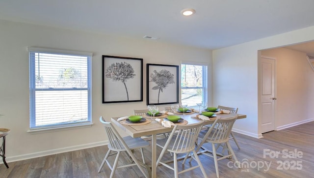 dining area featuring hardwood / wood-style floors