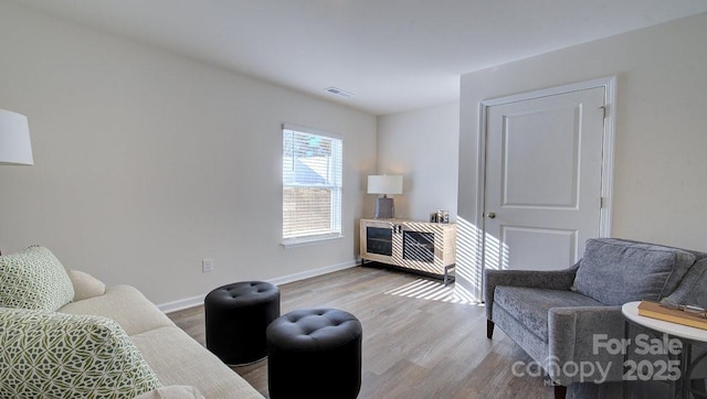 sitting room with light hardwood / wood-style floors