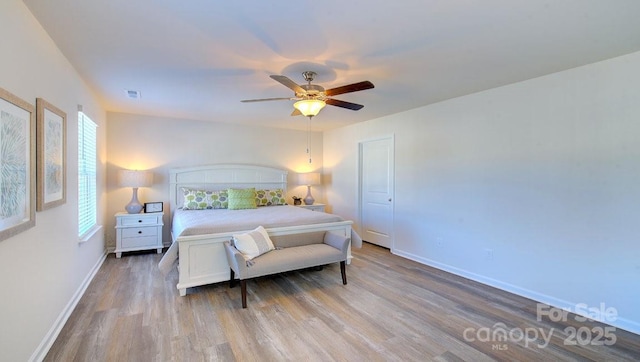 bedroom featuring ceiling fan and wood-type flooring