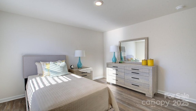 bedroom featuring dark wood-type flooring