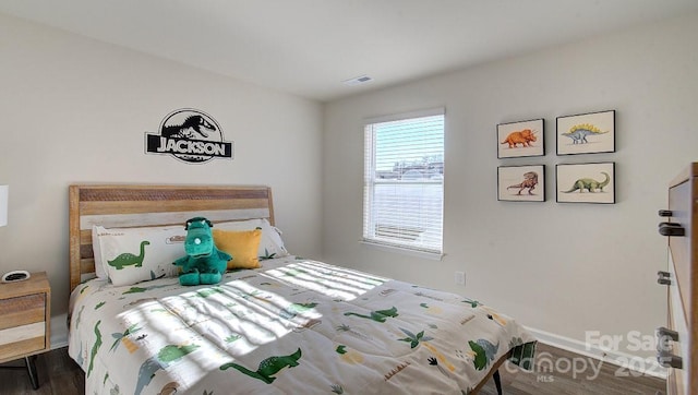 bedroom featuring dark wood-type flooring