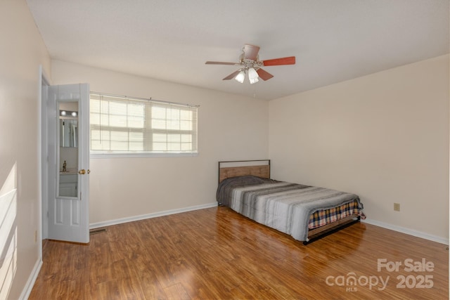 unfurnished bedroom with hardwood / wood-style floors and ceiling fan