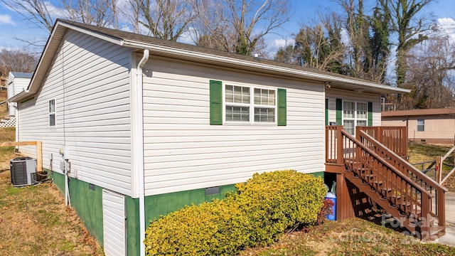 view of side of home with cooling unit