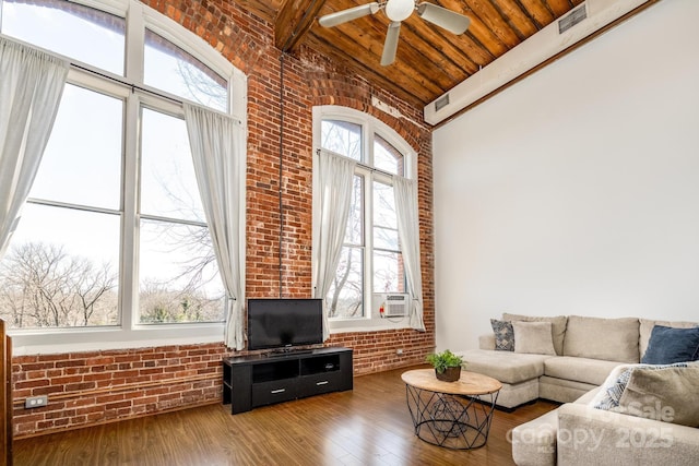 living room with wood-type flooring, brick wall, wood ceiling, and high vaulted ceiling