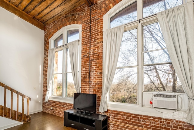 interior space with cooling unit, wood ceiling, and wood-type flooring