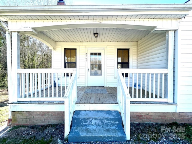 doorway to property with covered porch