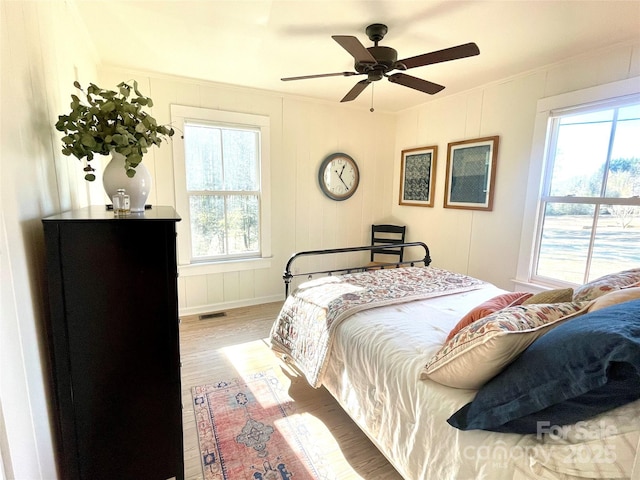 bedroom with hardwood / wood-style flooring and ceiling fan