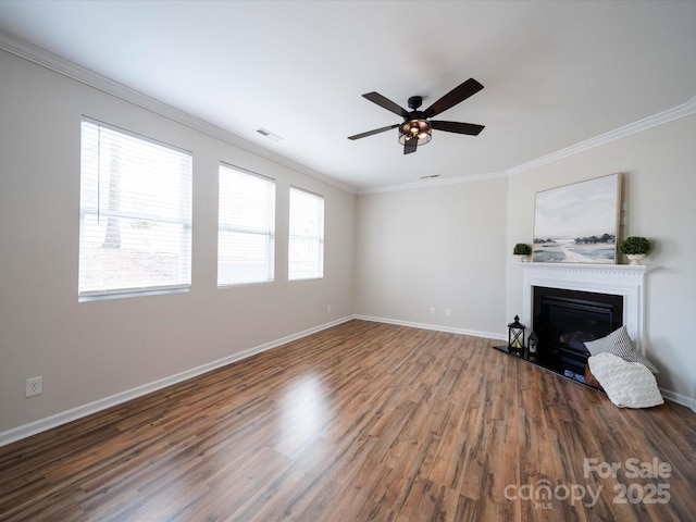 unfurnished living room with crown molding, wood-type flooring, and ceiling fan