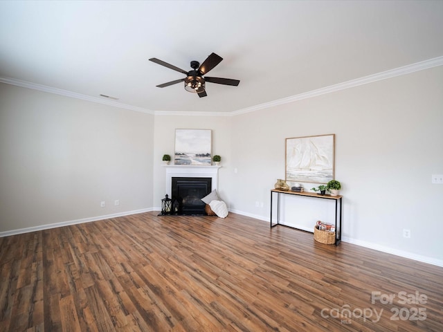 unfurnished living room with crown molding, dark hardwood / wood-style floors, and ceiling fan