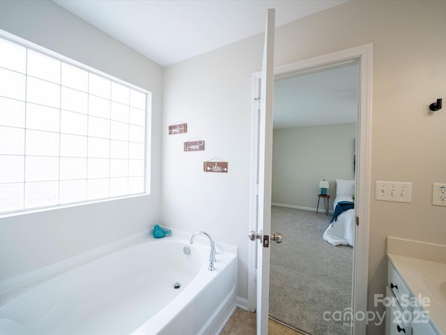 bathroom with vanity and a bathing tub