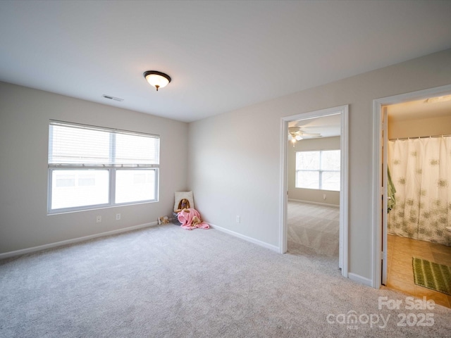 interior space featuring light colored carpet